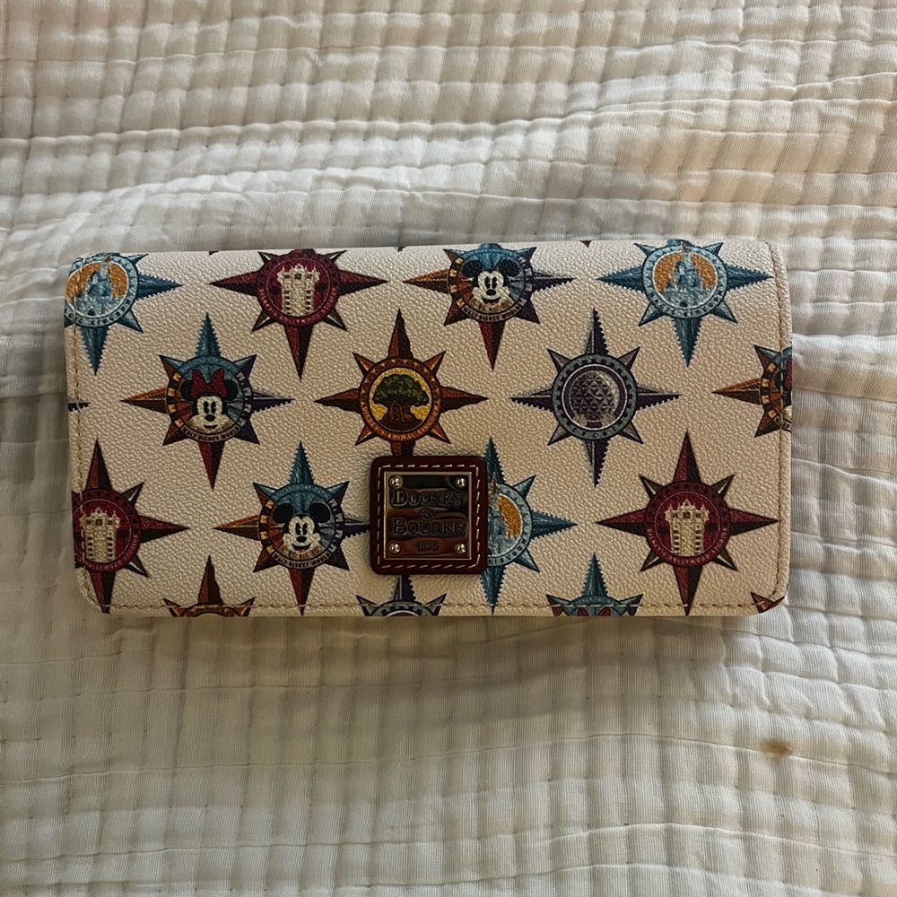 Limited Edition. Dooney and Bourke Disney Crossbody wallet. Parks Passport Print